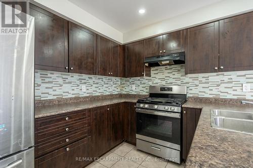 7 Brigham Avenue, Hamilton (Binbrook), ON - Indoor Photo Showing Kitchen With Double Sink