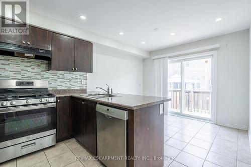 7 Brigham Avenue, Hamilton (Binbrook), ON - Indoor Photo Showing Kitchen With Double Sink