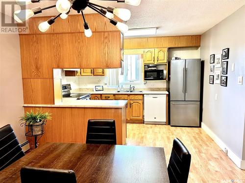 305 3140 Louise Street, Saskatoon, SK - Indoor Photo Showing Kitchen With Double Sink