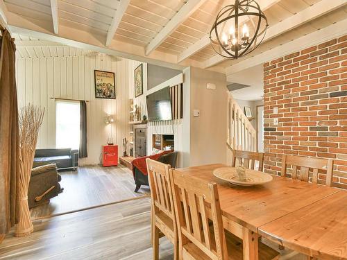 Vue d'ensemble - 102 Ch. Robitaille, Mont-Tremblant, QC - Indoor Photo Showing Dining Room With Fireplace