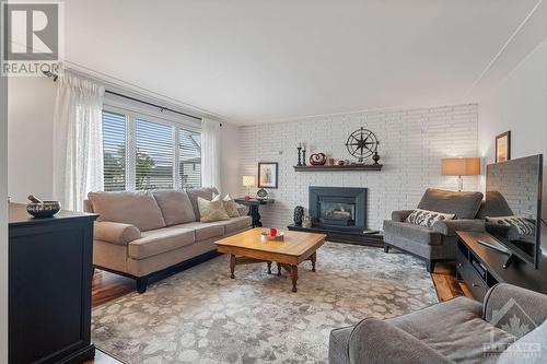 Living room with gas fireplace - 887 Notre Dame Street, Embrun, ON - Indoor Photo Showing Living Room With Fireplace