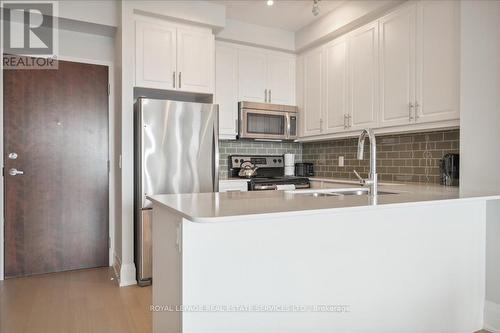 407 - 2480 Prince Michael Drive, Oakville (Iroquois Ridge North), ON - Indoor Photo Showing Kitchen With Stainless Steel Kitchen With Double Sink