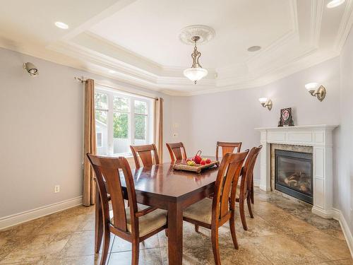 Salle Ã  manger - 406 Rue Des Plateaux, Mont-Saint-Hilaire, QC - Indoor Photo Showing Dining Room With Fireplace