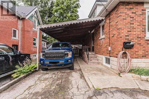 Car Port with single detached garage behind - 6 Rutherford Avenue E, Aylmer (Ay), ON - Outdoor With Exterior