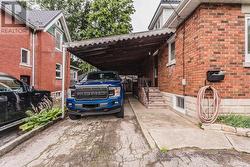 Car Port with single detached garage behind - 