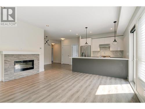 1883 Water Street Unit# 209, Kelowna, BC - Indoor Photo Showing Other Room With Fireplace