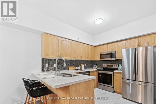 119 - 1496 Victoria Park Avenue, Toronto (Victoria Village), ON - Indoor Photo Showing Kitchen With Stainless Steel Kitchen With Double Sink