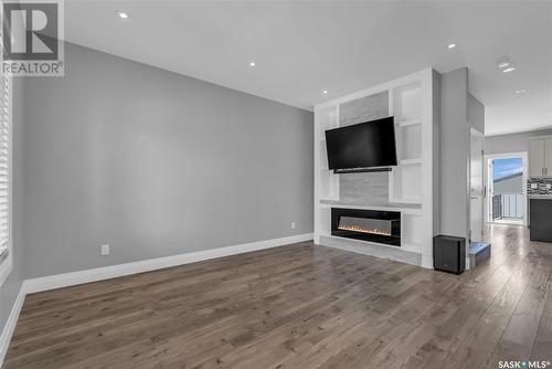 318 Kenaschuk Lane, Saskatoon, SK - Indoor Photo Showing Other Room With Fireplace