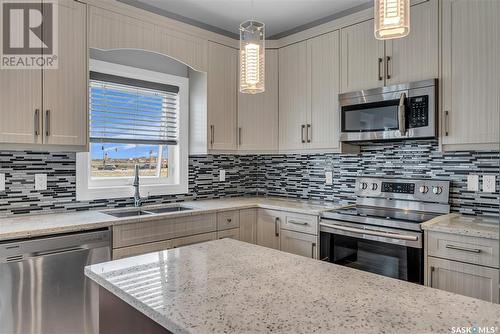 318 Kenaschuk Lane, Saskatoon, SK - Indoor Photo Showing Kitchen With Stainless Steel Kitchen With Double Sink With Upgraded Kitchen