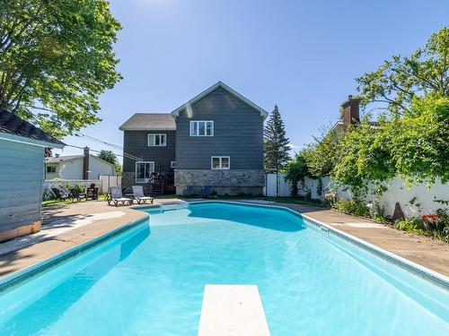 Back facade - 223 Rue Pinault, Vaudreuil-Dorion, QC - Outdoor With In Ground Pool With Backyard