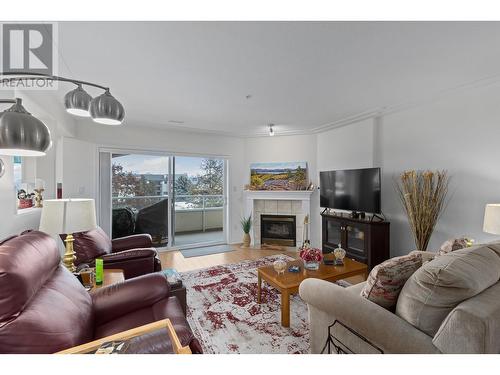 1895 Ambrosi Road Unit# 406, Kelowna, BC - Indoor Photo Showing Living Room With Fireplace