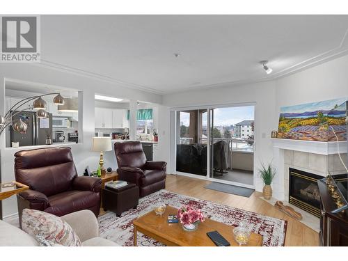 1895 Ambrosi Road Unit# 406, Kelowna, BC - Indoor Photo Showing Living Room With Fireplace