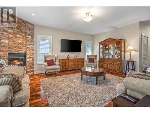 4939 Haskins Court, Kelowna, BC - Indoor Photo Showing Living Room With Fireplace