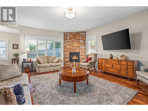 4939 Haskins Court, Kelowna, BC - Indoor Photo Showing Living Room With Fireplace