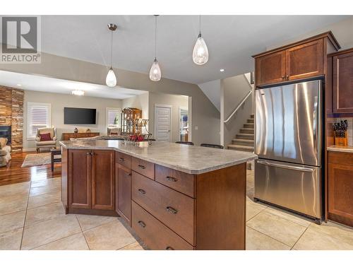 4939 Haskins Court, Kelowna, BC - Indoor Photo Showing Kitchen With Fireplace