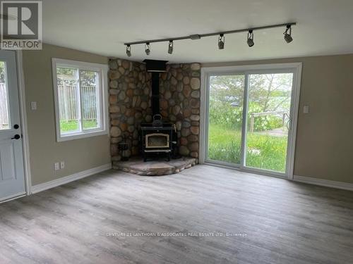 117 Juniper Lane S, Prince Edward County (Ameliasburgh), ON - Indoor Photo Showing Living Room With Fireplace