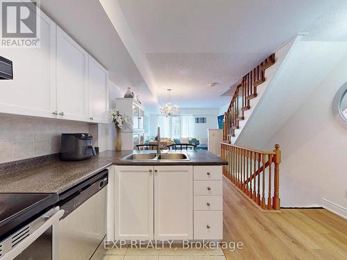 102 - 65 Turntable Crescent, Toronto (Dovercourt-Wallace Emerson-Junction), ON - Indoor Photo Showing Kitchen With Double Sink