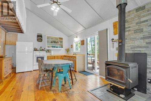 1092 1096 Ridge Lane, North Frontenac, ON - Indoor Photo Showing Dining Room With Fireplace