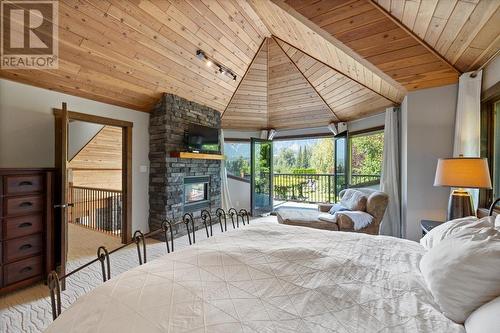 3988 Mcgiverin Road, Fernie, BC - Indoor Photo Showing Bedroom With Fireplace