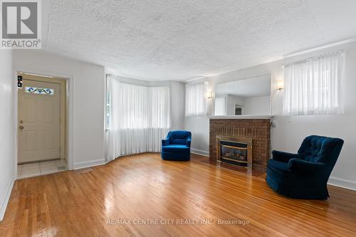 36 Briscoe Street E, London, ON - Indoor Photo Showing Living Room With Fireplace