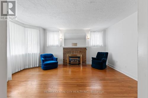 36 Briscoe Street E, London, ON - Indoor Photo Showing Living Room With Fireplace