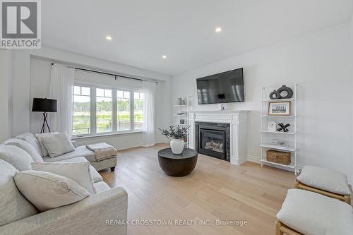 23 Lorne Thomas Place, New Tecumseth, ON - Indoor Photo Showing Living Room With Fireplace