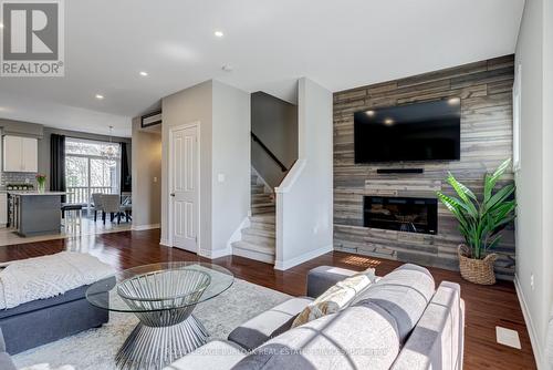 23 - 4165 Upper Middle Road, Burlington (Rose), ON - Indoor Photo Showing Living Room With Fireplace