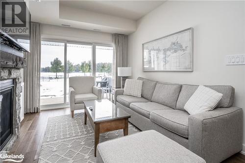 1869 Highway 118 W Unit# Bhv-B-105, Bracebridge, ON - Indoor Photo Showing Living Room With Fireplace