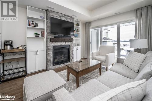 1869 Highway 118 W Unit# Bhv-B-105, Bracebridge, ON - Indoor Photo Showing Living Room With Fireplace