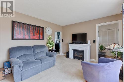 74 Barnet Boulevard, Renfrew, ON - Indoor Photo Showing Living Room With Fireplace