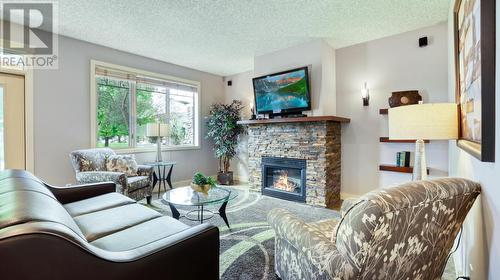 500 Bighorn Boulevard Unit# 512C, Radium Hot Springs, BC - Indoor Photo Showing Living Room With Fireplace