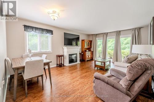 212 - 10 Coulter Street, Barrie (Sunnidale), ON - Indoor Photo Showing Other Room With Fireplace