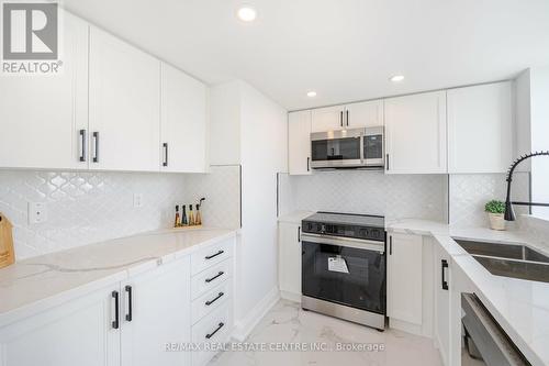 1404 - 1360 Rathburn Road E, Mississauga (Rathwood), ON - Indoor Photo Showing Kitchen With Double Sink