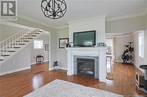 699 Route 105, Maugerville, NB - Indoor Photo Showing Living Room With Fireplace