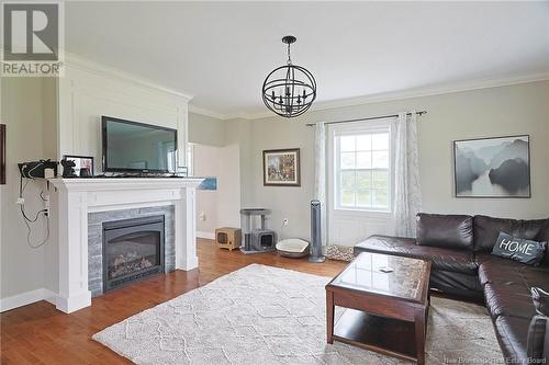 699 Route 105, Maugerville, NB - Indoor Photo Showing Living Room With Fireplace