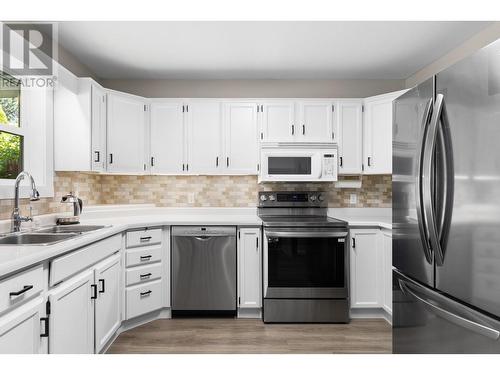 1586 Carshyl Court, Kelowna, BC - Indoor Photo Showing Kitchen With Double Sink