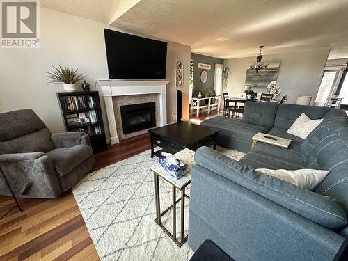 5543 Maxhamish Crescent, Fort Nelson, BC - Indoor Photo Showing Living Room With Fireplace