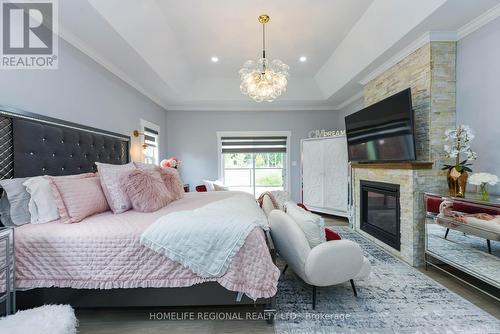 8922 Wellington 124 Road, Erin, ON - Indoor Photo Showing Bedroom With Fireplace