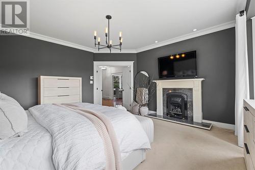 35 Cherry Lane, Conception Bay South, NL - Indoor Photo Showing Bedroom With Fireplace