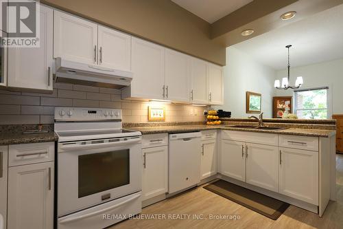 21 - 55 Lake Road W, Lambton Shores (Grand Bend), ON - Indoor Photo Showing Kitchen With Double Sink