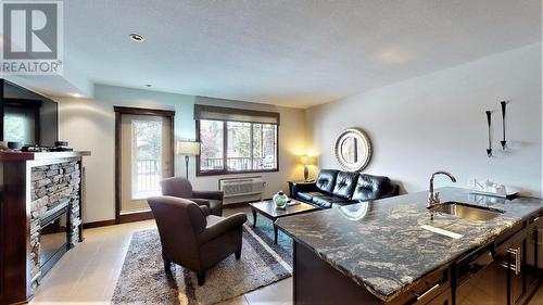 700 Bighorn  Boulevard Unit# 715 D, Radium Hot Springs, BC - Indoor With Fireplace