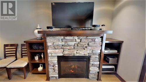 700 Bighorn  Boulevard Unit# 715 D, Radium Hot Springs, BC - Indoor Photo Showing Other Room With Fireplace