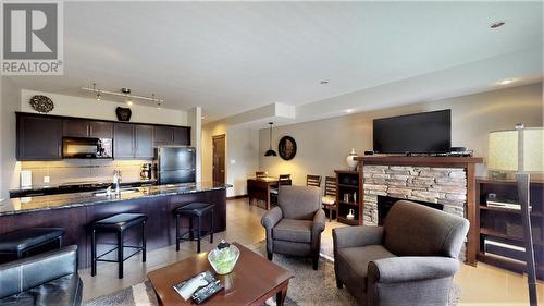 700 Bighorn  Boulevard Unit# 715 D, Radium Hot Springs, BC - Indoor Photo Showing Living Room With Fireplace