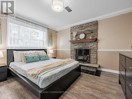 34 Alpaca Drive, Toronto (Woburn), ON - Indoor Photo Showing Bedroom With Fireplace