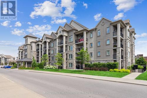 205 - 1450 Main Street E, Milton (Dempsey), ON - Outdoor With Balcony With Facade