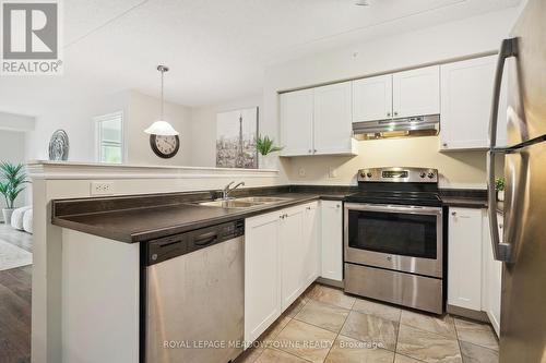 205 - 1450 Main Street E, Milton (Dempsey), ON - Indoor Photo Showing Kitchen With Stainless Steel Kitchen With Double Sink