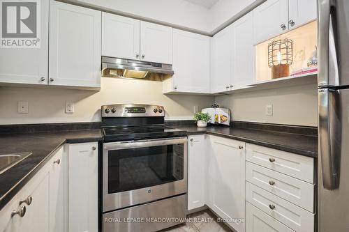 205 - 1450 Main Street E, Milton (Dempsey), ON - Indoor Photo Showing Kitchen With Stainless Steel Kitchen