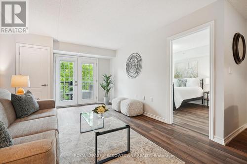 205 - 1450 Main Street E, Milton (Dempsey), ON - Indoor Photo Showing Living Room