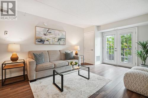 205 - 1450 Main Street E, Milton (Dempsey), ON - Indoor Photo Showing Living Room