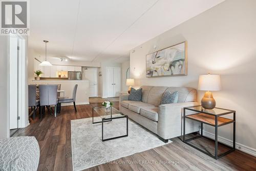 205 - 1450 Main Street E, Milton (Dempsey), ON - Indoor Photo Showing Living Room